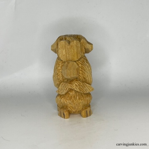 Paw lines added to wood carved dog
