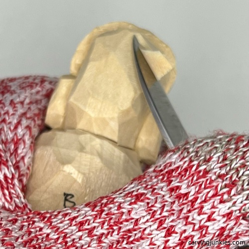 Carving back of earworm caricature carving