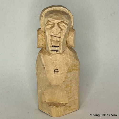  Bottom of mouth and teeth are sketched on earworm caricature carving