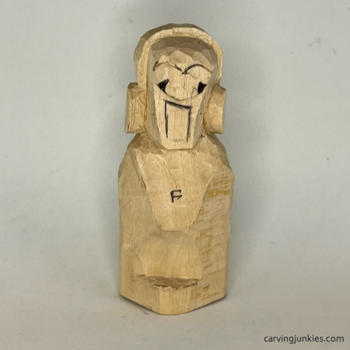 Guidelines are added to earworm caricature carving