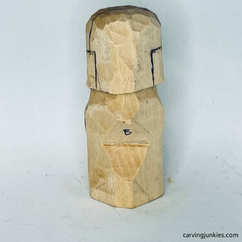 Sketched headphones on back of earworm caricature carving