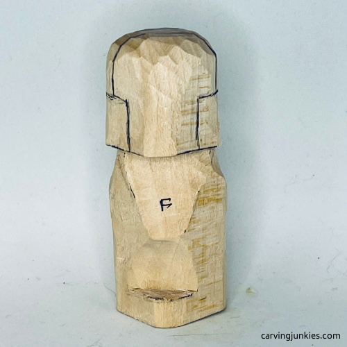 Sketched headphones on front of earworm caricature carving