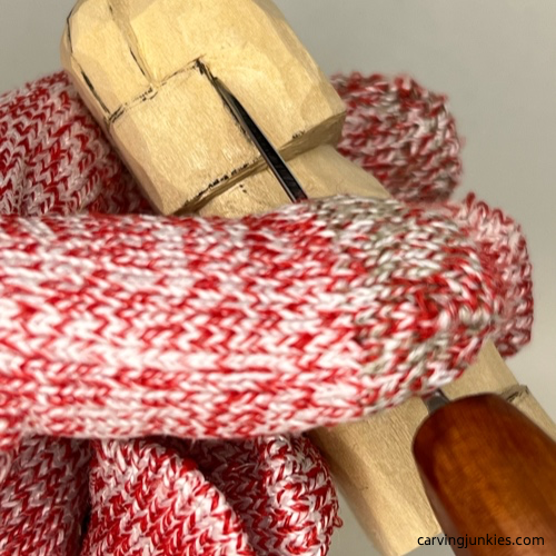 Left view of earworm wood carving