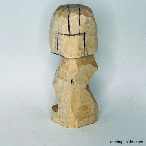 Left view of earworm wood carving