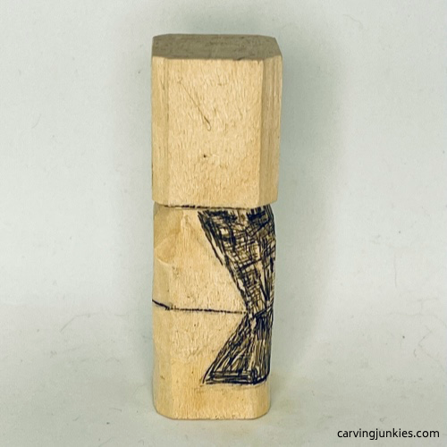 Left  view of wood to remove on earworm caricature carving