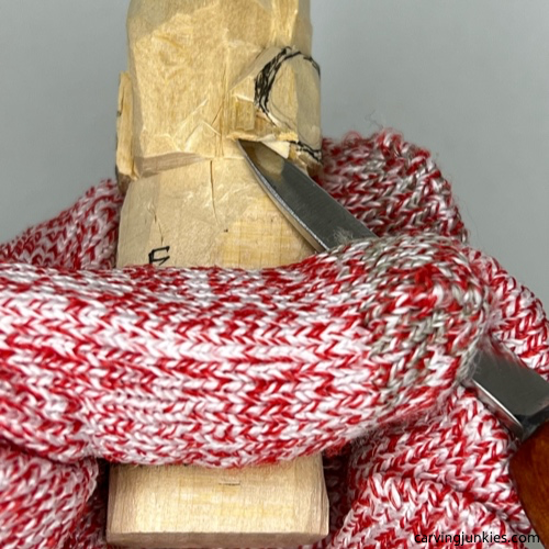 Refining earpiece on earworm caricature carving