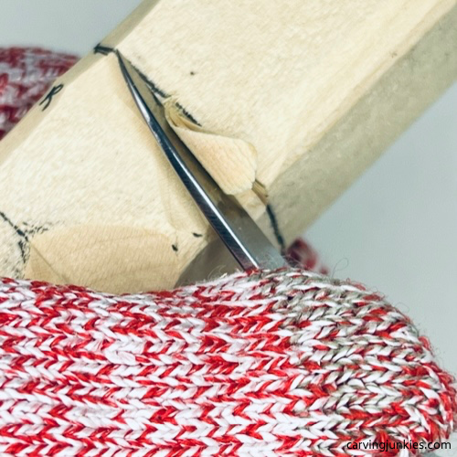 Separating head on earworm caricature carving