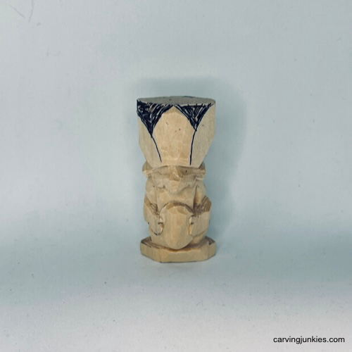 Wood is marked for removal on Easter whittle.