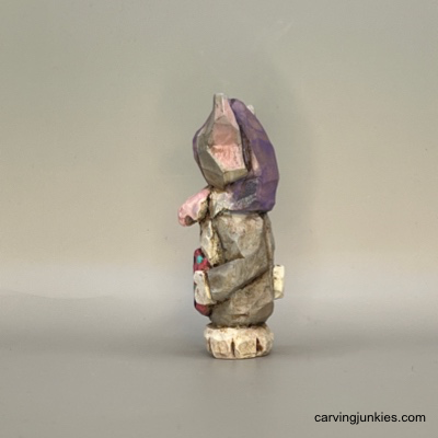 Left view of painted Easter whittle