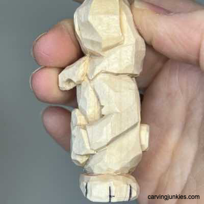 Paws are marked on whittled Easter bunny