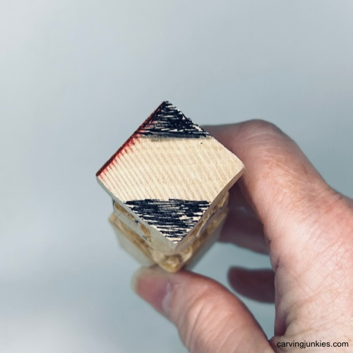 Bottom of paws are sketched on Easter whittle.