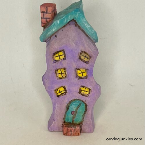 Front view of painted easy whittled house