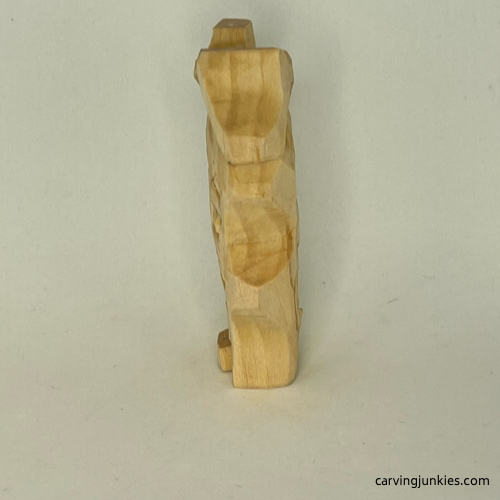 Left  view of unpainted easy wood whittled house