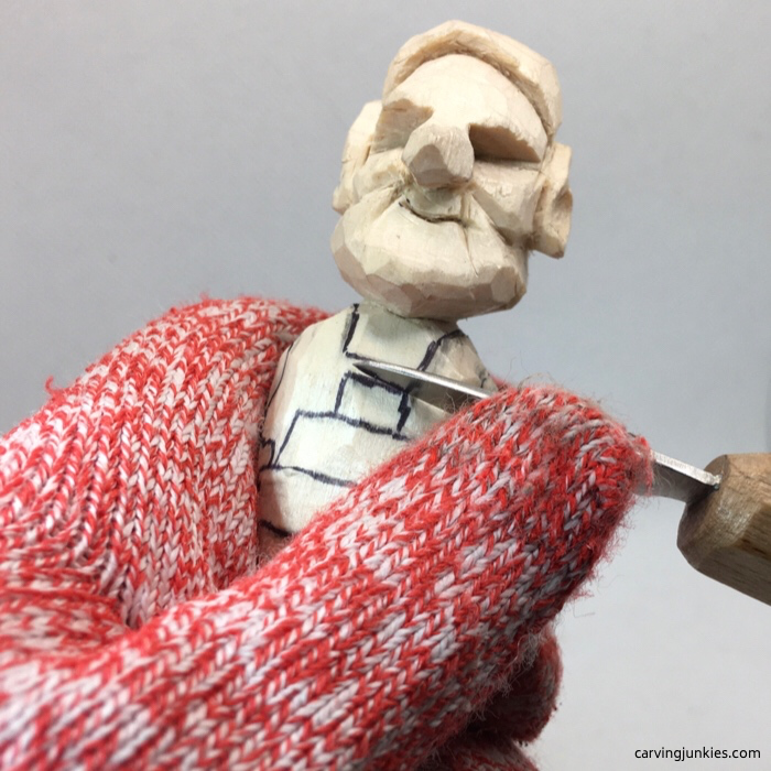 Carving details on wood elf