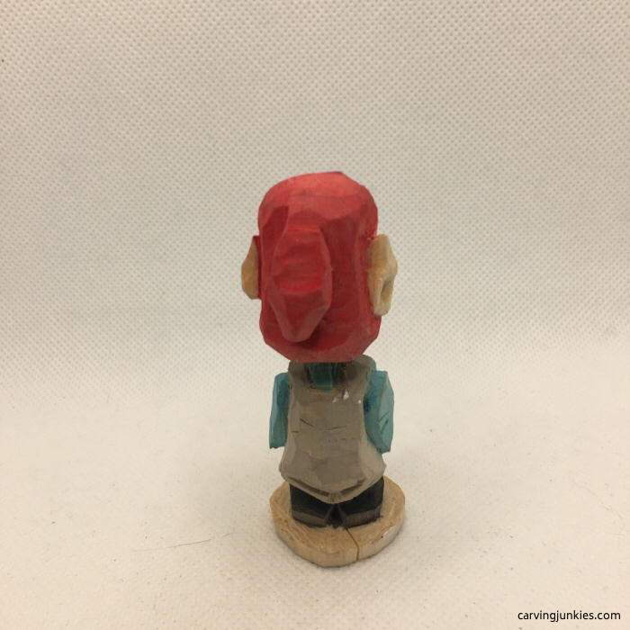 Back view of painted wooden elf