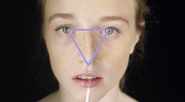 placing eyes and nose on a wood carving