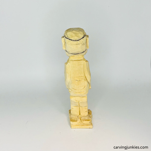 Hair drawn on back of screw-up fairy wood caricture Back hair on screw-up fairy wood caricature