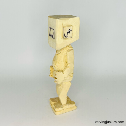 Carving face on screw-up fairy wood caricature Separated ear on screw-up fairy wood caricature