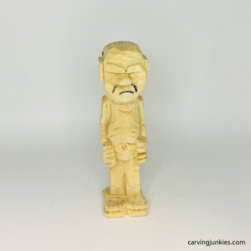 Mouth is drawn on screw-up fairy wood caricature Smile lines drawn on screw-up fairy wood caricature