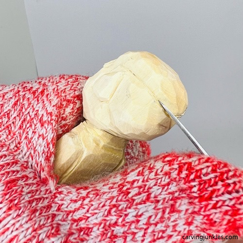 Cutting hairline on screw-up fairy wood caricture Carving the hairline on screw-up fairy wood caricture