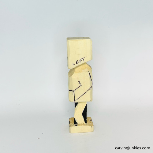 Left side of marked wood to remove on screw-up fairy wood caricature Left view of wood to remove on screw-up fairy wood caricature