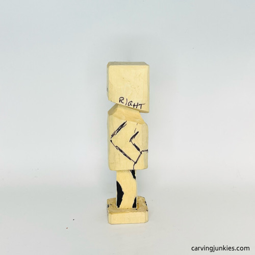 Right side marked for wood removal on screw-up fairy wood caricature Marking wood to remove on right side of screw-up fairy wood caricature