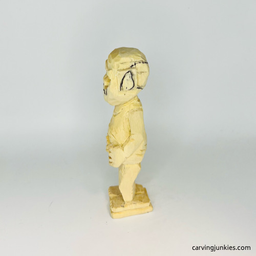 View of drawn left ear on screw-up fairy wood caricature Left ear drawn on screw-up fairy wood caricature