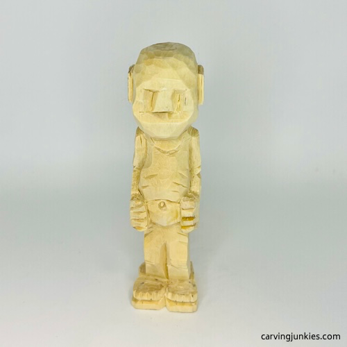 Nose is carved on screw-up fairy wood caricature Second pyramid cut on screw-up fairy wood caricature