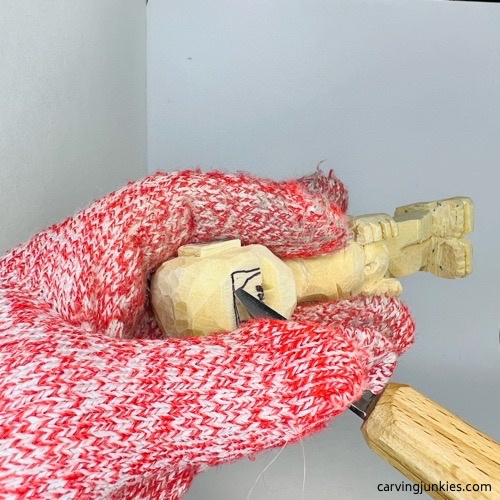 First pyramid cut on screw-up fairy wood caricature Making pyramid cut on screw-up fairy wood caricature