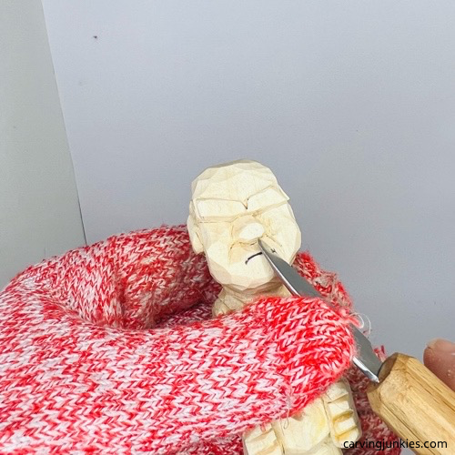 Cutting smile line on screw-up fairy wood caricature Carving smile lines on screw-up fairy wood caricature