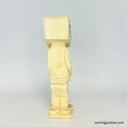 Back carved details on screw-up fairy wood caricature Back of carved arms on screw-up fairy wood caricature