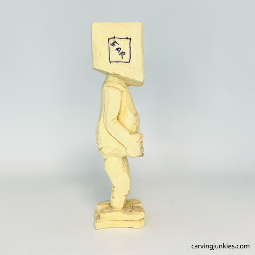 Right side of carved arm on screw-up fairy caricature Right ear box on screw-up fairy caricature