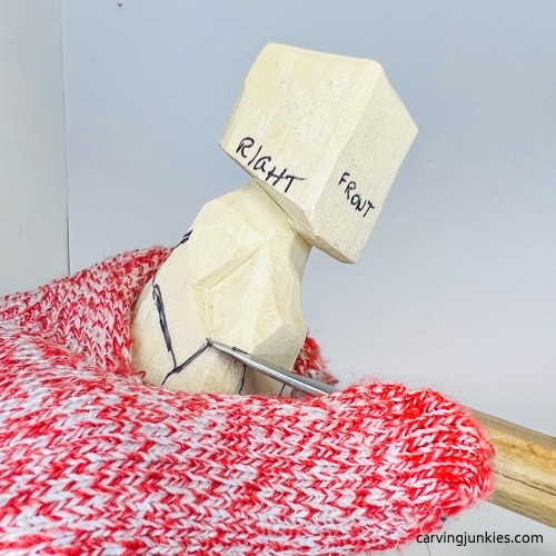 Cutting arms on screw-up fairy wood caricature Carving arms on screw-up fairy wood caricature