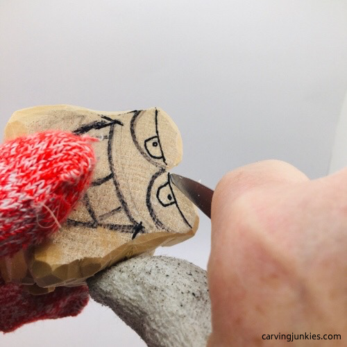 Caring eyelids on wooden fish carving