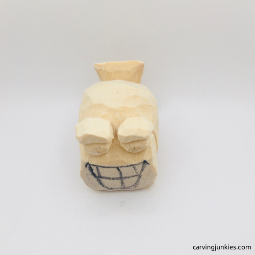 Finished eyes on wooden fish carving