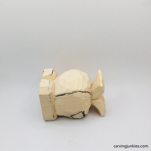 Left fin drawn on fish carving