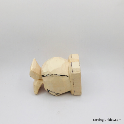 Fins drawn on wooden fish