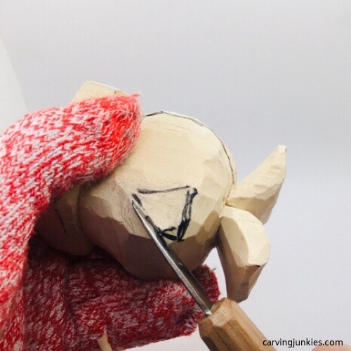 Separating fin on wooden fish carving