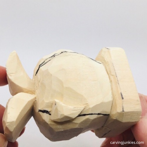 Marked wood to remove on wooden fish carving