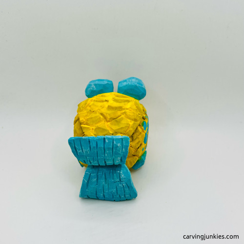 Back view of fish carving after painting Back side of painted fish carving