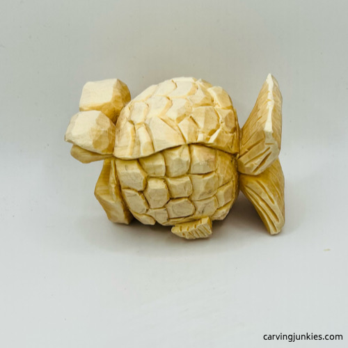 Left side of unpainted fish carving