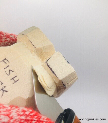 Rounding eyes on fish carving