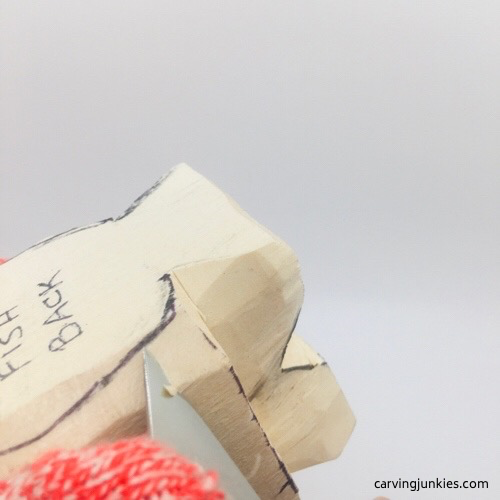 Shaping back of fish carving