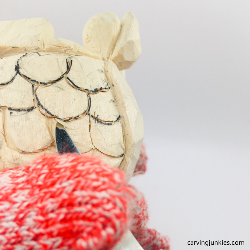 Removing wood on scales on wooden fish carving