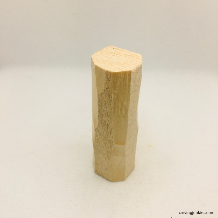 Corners carved off wood block