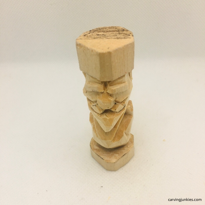 Mustache is carved on flat plane wood figure