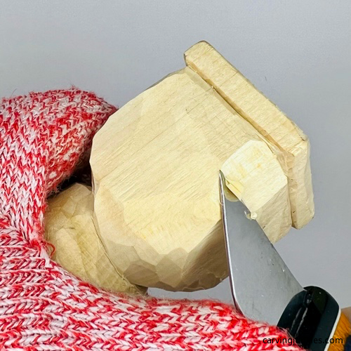 Shaping body of frog carving