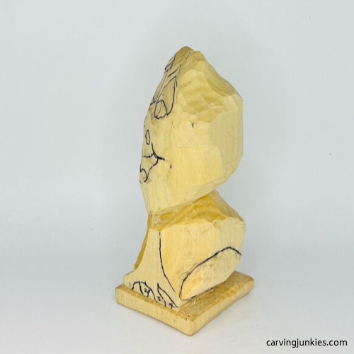 Left side of drawn legs on frog carving