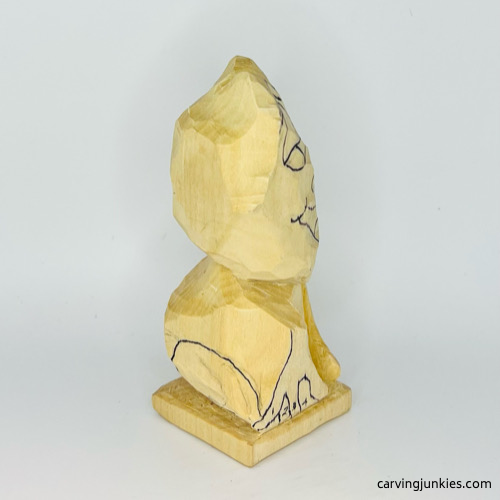 Back view of drawn legs on frog carving