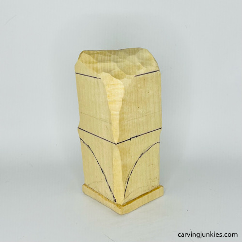 Back view of leg guidelines on wooden frog carving